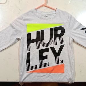 Medium size. Hurley brand. Grey green and red coloring